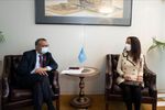 WHO Director-General Dr. Tedros and I are discussing the report in his office. We're sitting in armchairs, both wearing face masks, and my braille computer is in my lap. The small round table between us has the WHO flag, and on the wall is a framed image of the WHO's Headquarters building in Geneva.