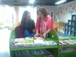 Haben and Tai read braille books at Library for the Blind