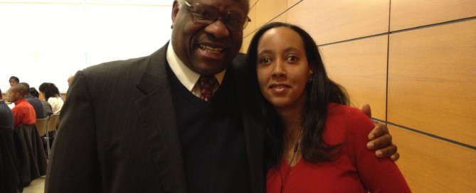 Supreme Court Justice Clarence Thomas and Haben Girma posing together at Harvard Law School.