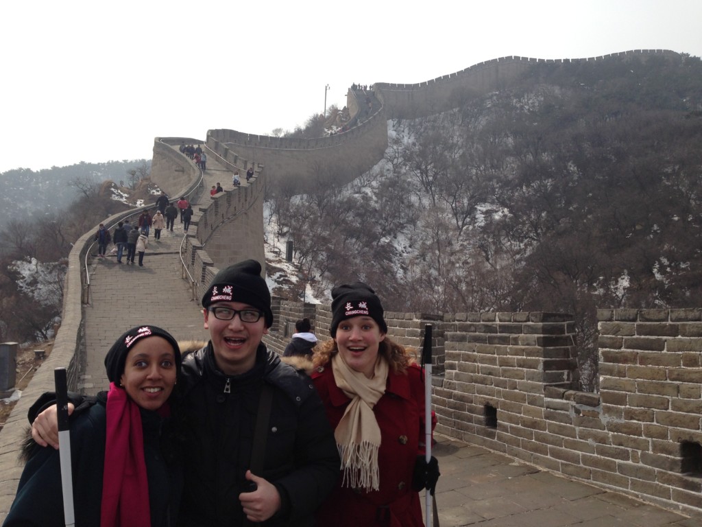 Haben, Shuang, Tai pose on great wall with wall winding in background