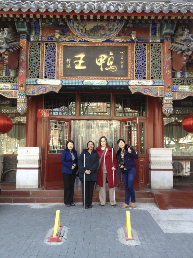 Haben, Tai, Xu Fei, and Xie Piao in front of roast duck restaurant
