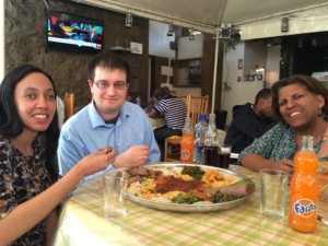 Haben, Gordon, and Aster having lunch at a restaurant in Addis
