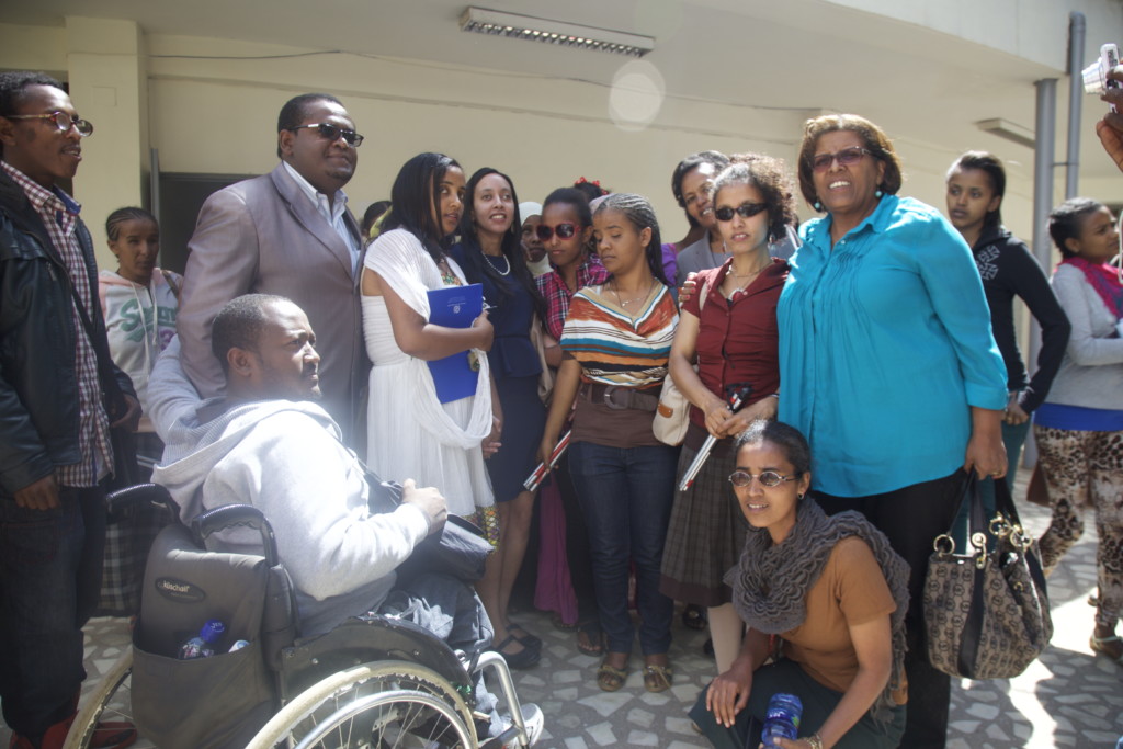 Haben and Aster posing with disabled students at Addis University.