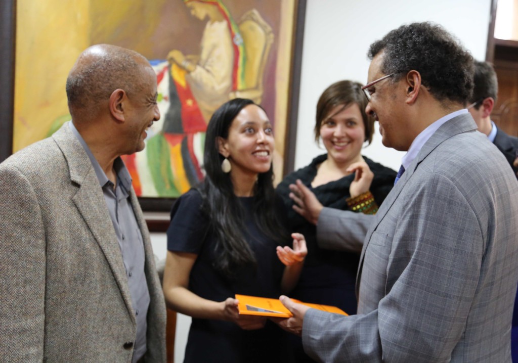 Dr. Tedros gives Haben a traditional scarf.