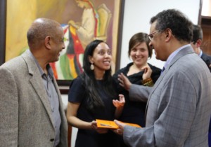 Dr. Tedros gives Haben a traditional scarf.