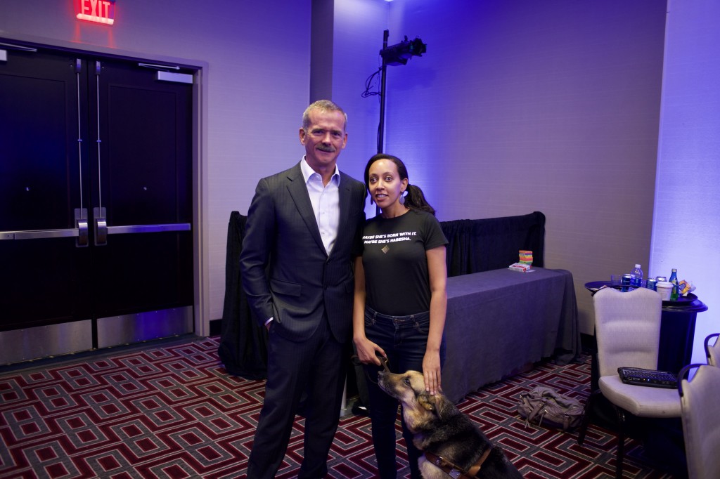 Chris Hadfield stands next to Haben Girma and her guide dog Maxine at the Clio Cloud conference in New Orleans. Photo curtesy of Clio.