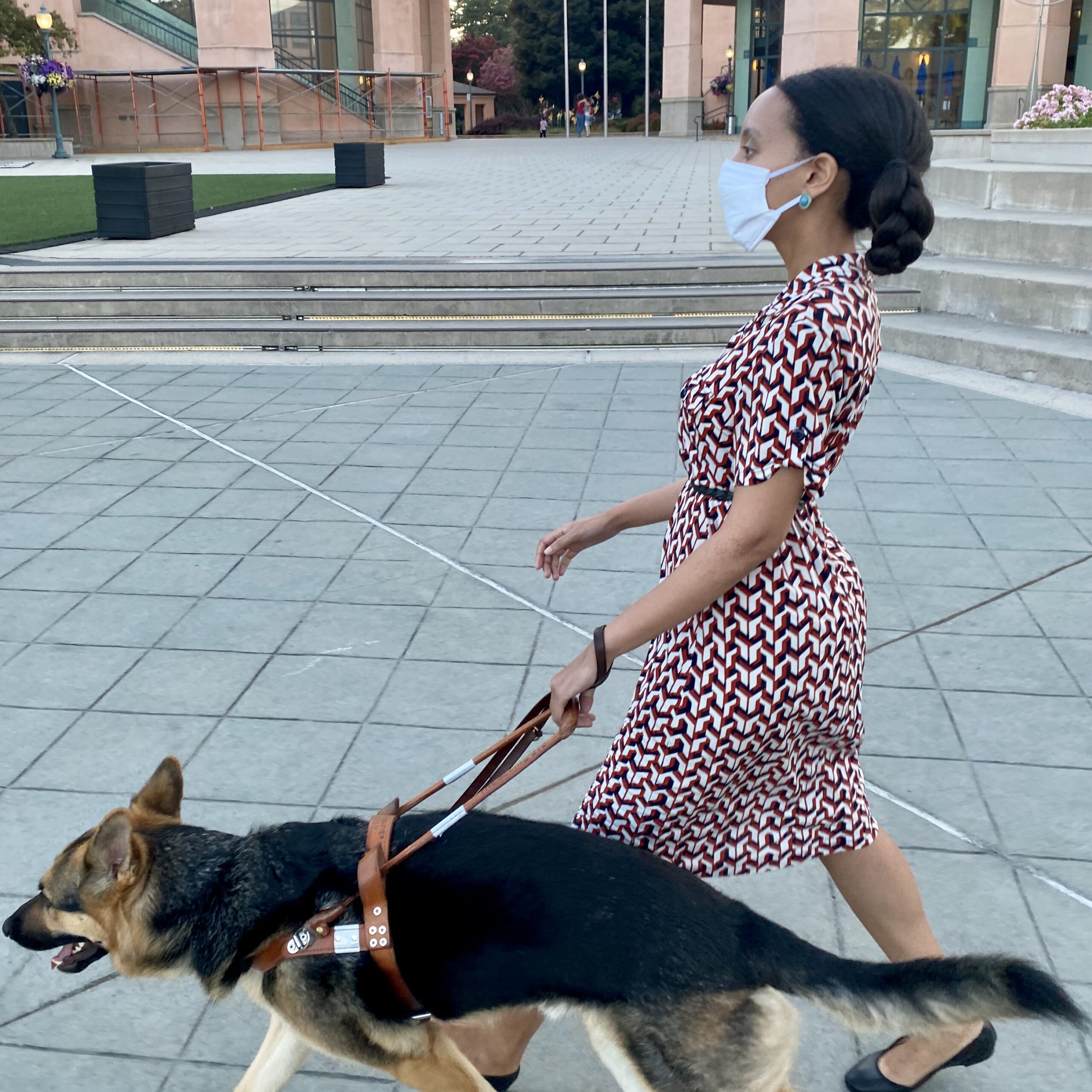 Haben Girma and her guide dog Mylo walking on the sidewalks of downtown Mountain View, CA.